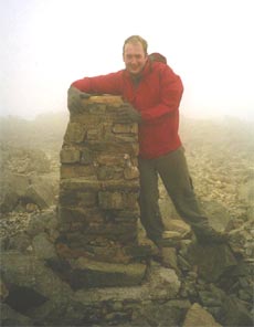 Gareth at a very windy summit!